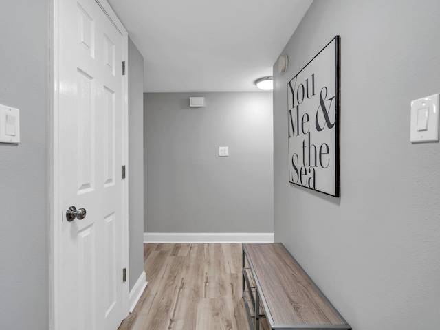 hallway with light wood-type flooring