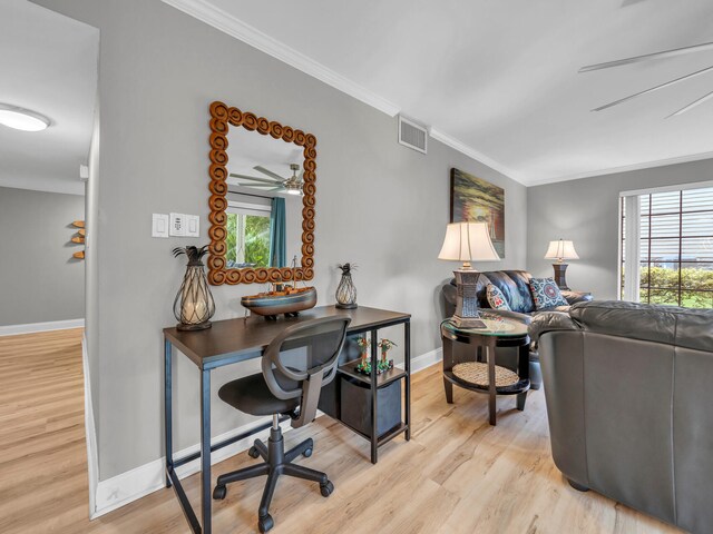 452 N Driftwood Bay Unit 96B, Miramar Beach, FL 32550 - living room featuring plenty of natural light, wood finished floors, and ornamental molding