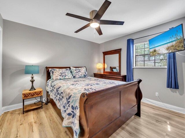 bedroom with ceiling fan and light hardwood / wood-style flooring