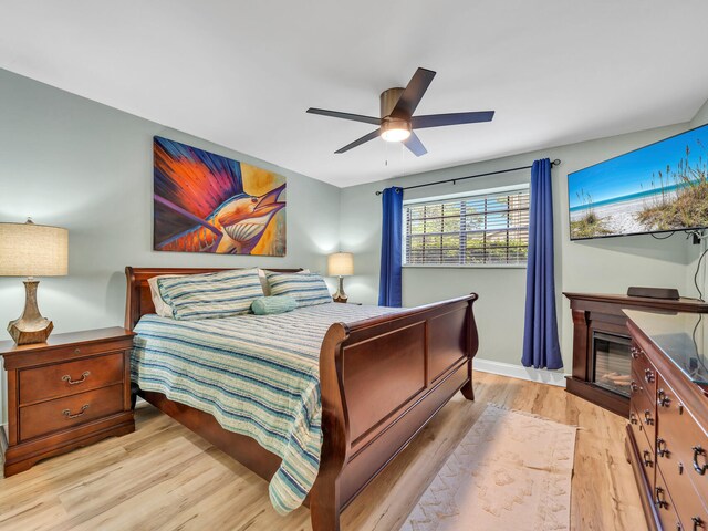452 N Driftwood Bay Unit 96B, Miramar Beach, FL 32550 - bedroom featuring baseboards, light wood-style flooring, and a ceiling fan