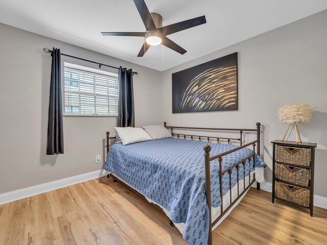 452 N Driftwood Bay Unit 96B, Miramar Beach, FL 32550 - bedroom with baseboards, wood finished floors, and a ceiling fan