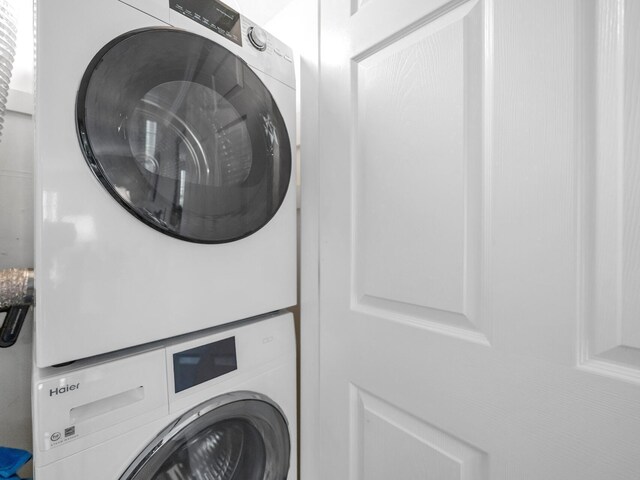452 N Driftwood Bay Unit 96B, Miramar Beach, FL 32550 - laundry room featuring stacked washer / dryer and laundry area