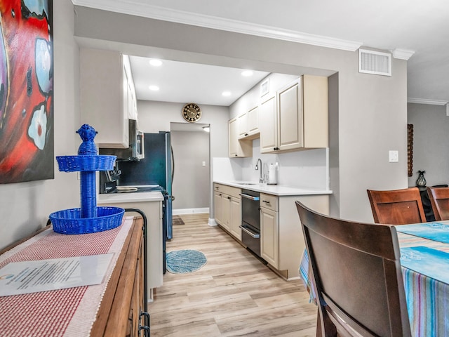 kitchen featuring light wood-type flooring, crown molding, dishwasher, stove, and sink