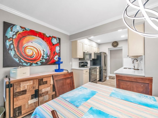 interior space featuring crown molding, white cabinetry, stainless steel appliances, sink, and light hardwood / wood-style floors