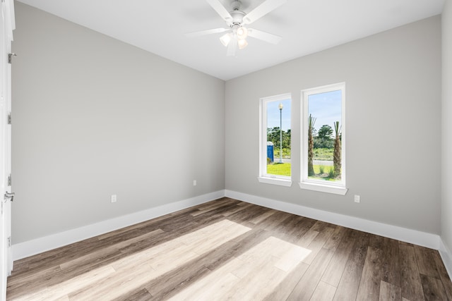 unfurnished room featuring ceiling fan and light hardwood / wood-style flooring