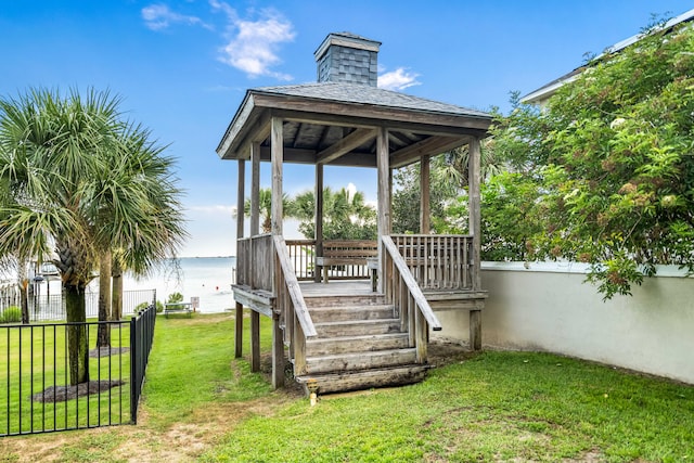 exterior space with a gazebo and a water view