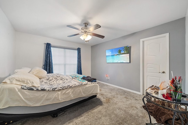 carpeted bedroom with ceiling fan and multiple windows