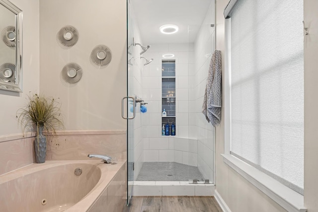 bathroom with hardwood / wood-style flooring and plus walk in shower