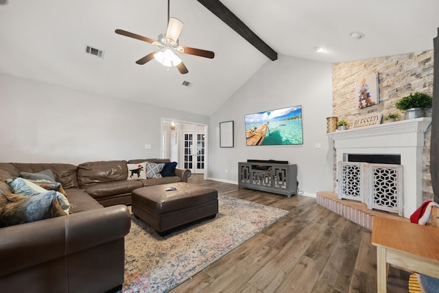 living room with ceiling fan, high vaulted ceiling, beam ceiling, french doors, and hardwood / wood-style flooring