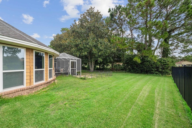 view of yard featuring a lanai