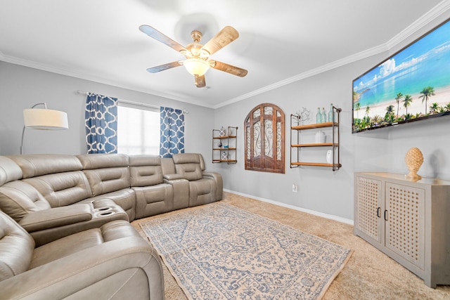 carpeted living room with ceiling fan and ornamental molding