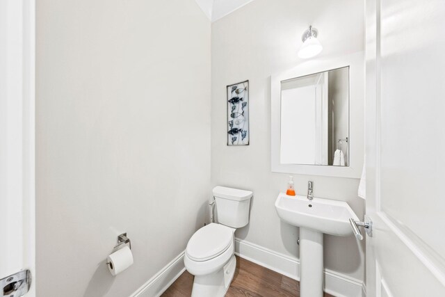 bathroom featuring toilet and hardwood / wood-style floors