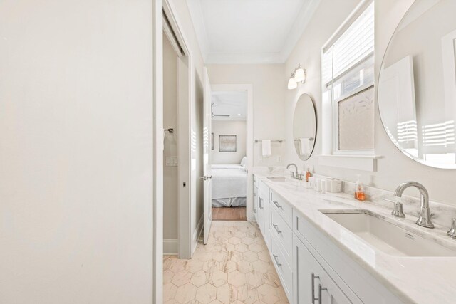 bathroom with tile patterned flooring, dual vanity, and crown molding