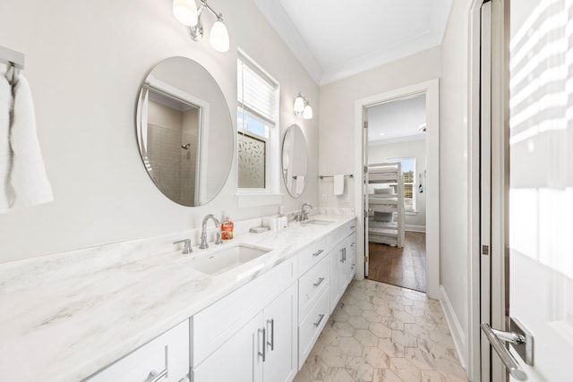 bathroom with double vanity, hardwood / wood-style flooring, and ornamental molding