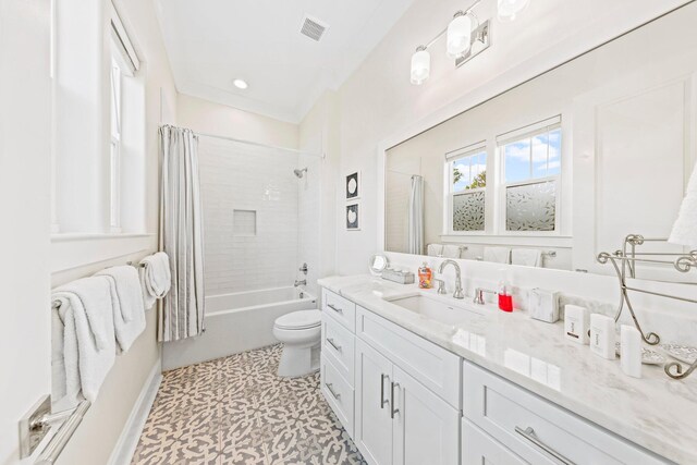 full bathroom featuring tile patterned flooring, shower / bath combo, toilet, and vanity