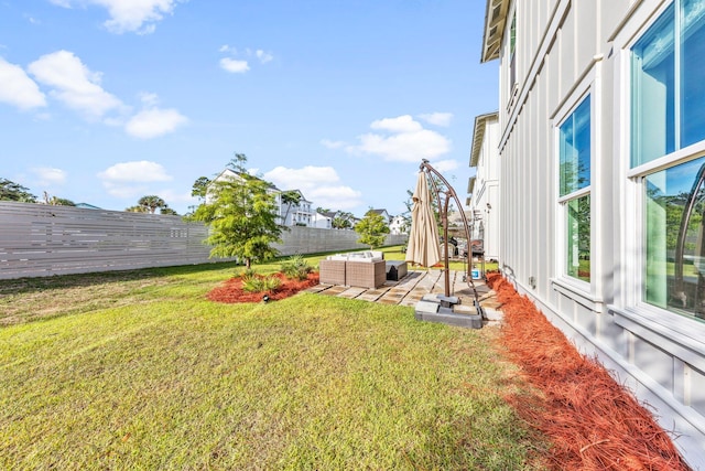 view of yard with outdoor lounge area and a patio