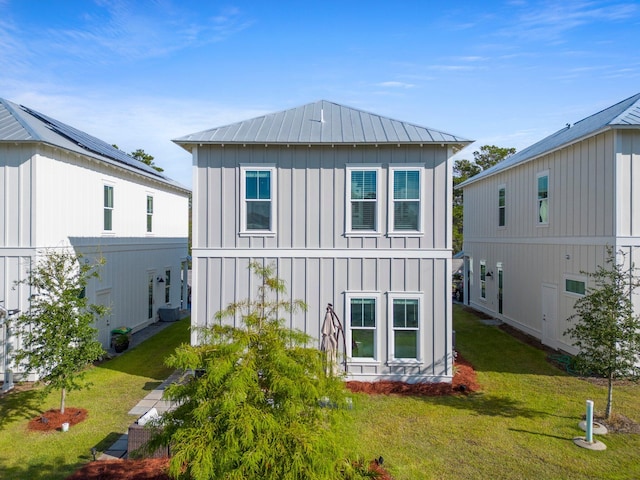 rear view of house with a yard