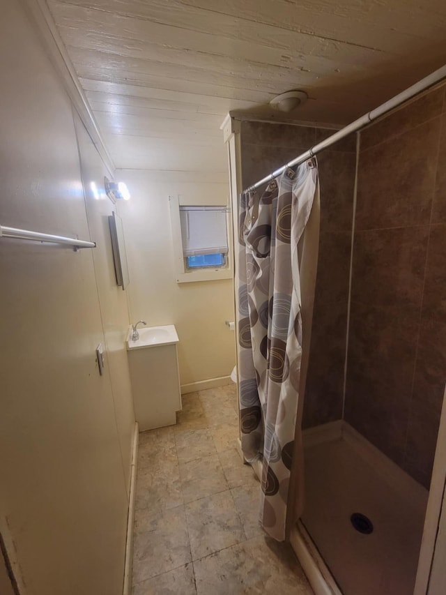 bathroom featuring wooden ceiling, vanity, curtained shower, and tile patterned floors