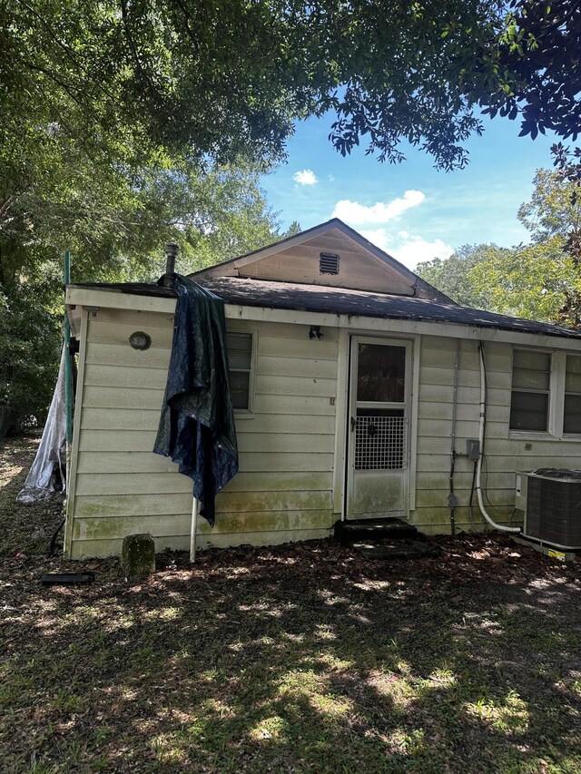 back of property with central air condition unit