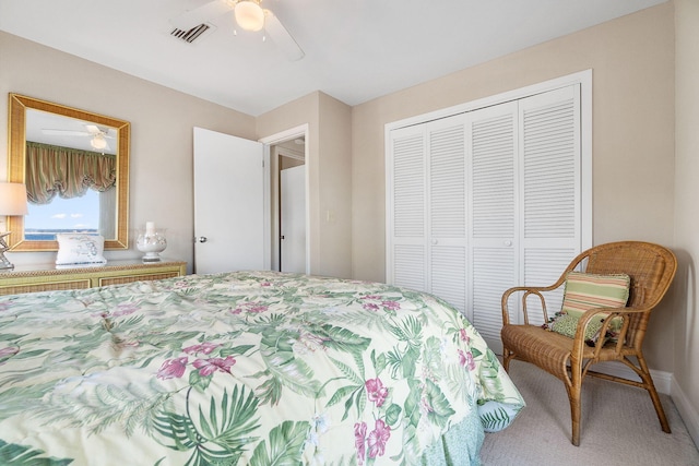 bedroom with ceiling fan and a closet