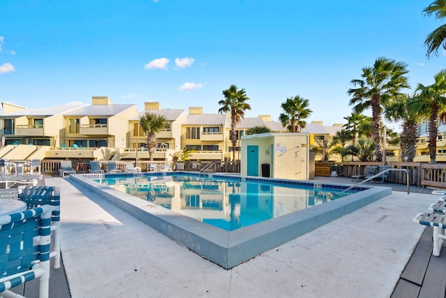 view of swimming pool with a patio