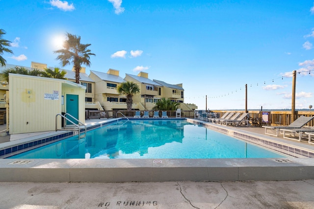 view of swimming pool featuring a patio area