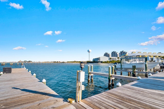 view of dock with a water view and central air condition unit