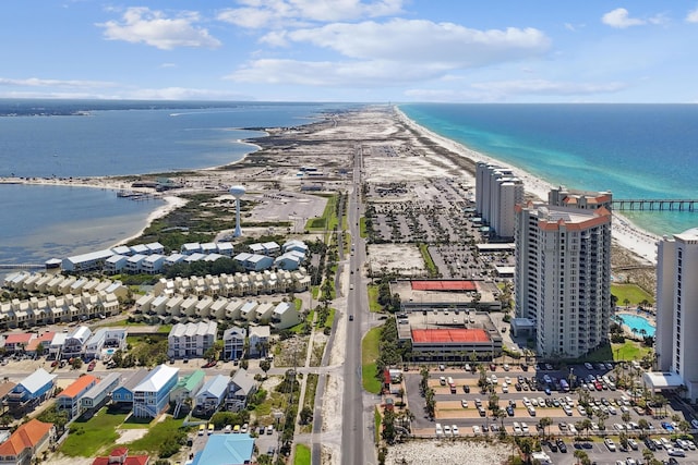 drone / aerial view with a water view and a view of the beach