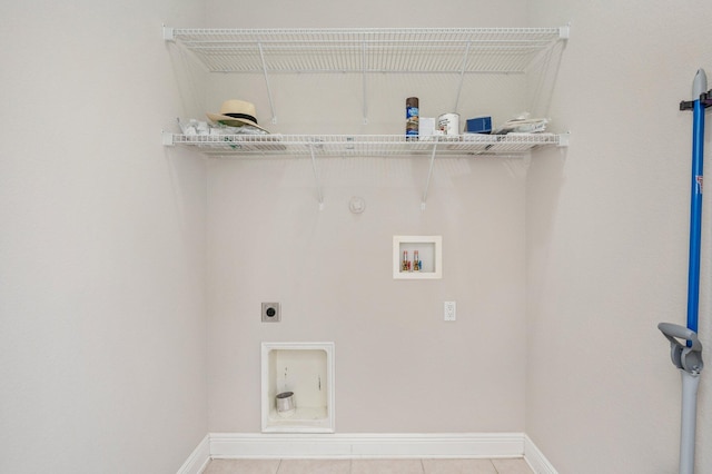 laundry area featuring tile patterned floors, electric dryer hookup, hookup for a gas dryer, and hookup for a washing machine