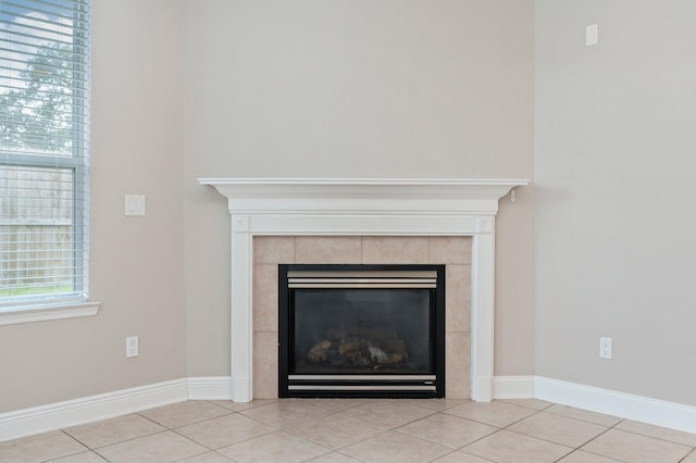 details featuring a tile fireplace and tile patterned floors