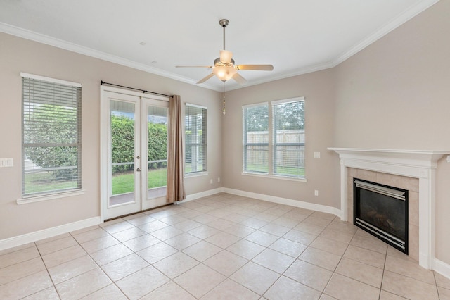 unfurnished living room with light tile patterned floors, a wealth of natural light, and ceiling fan