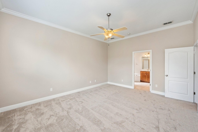 unfurnished bedroom with light carpet, connected bathroom, ornamental molding, and ceiling fan