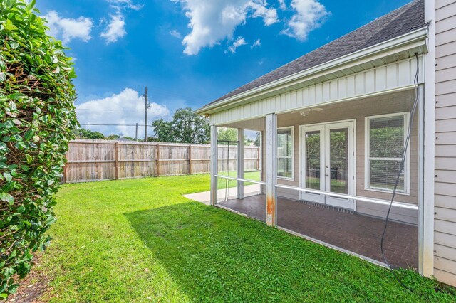 view of yard with french doors