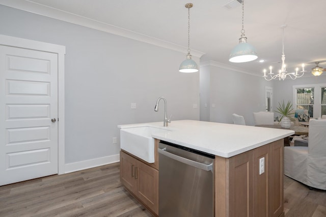 kitchen featuring dishwasher, light wood-style flooring, ornamental molding, open floor plan, and a sink