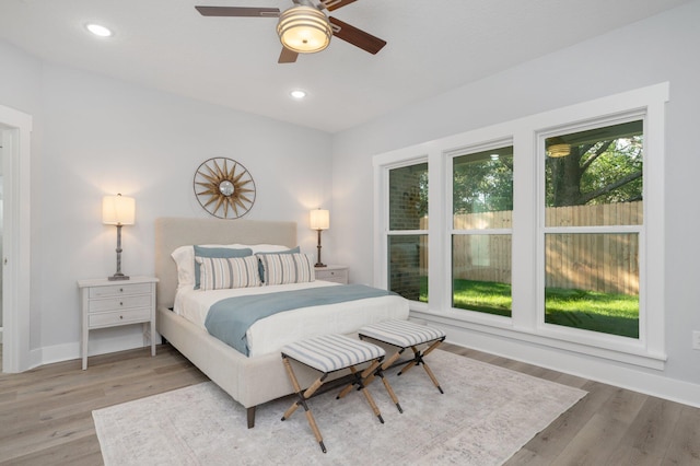 bedroom featuring recessed lighting, baseboards, and wood finished floors