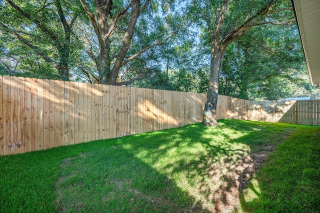 view of yard with a fenced backyard