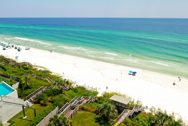 aerial view with a water view and a view of the beach