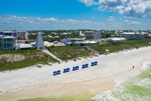 bird's eye view with a water view and a view of the beach