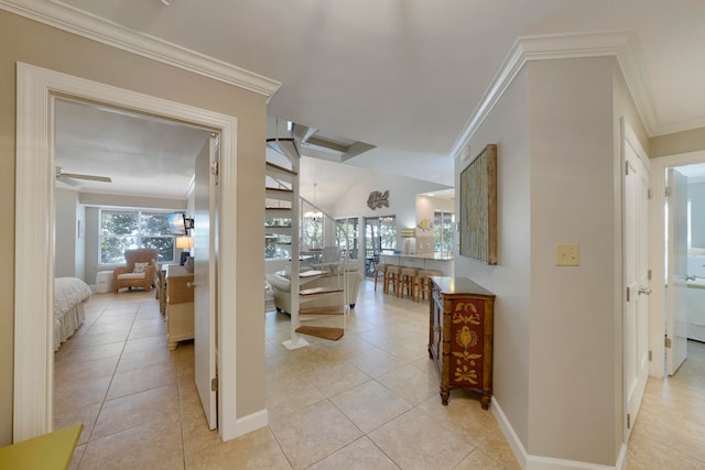 corridor with ornamental molding and light tile patterned floors