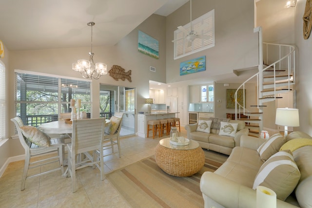 living room featuring light tile patterned floors, ceiling fan with notable chandelier, beverage cooler, sink, and high vaulted ceiling