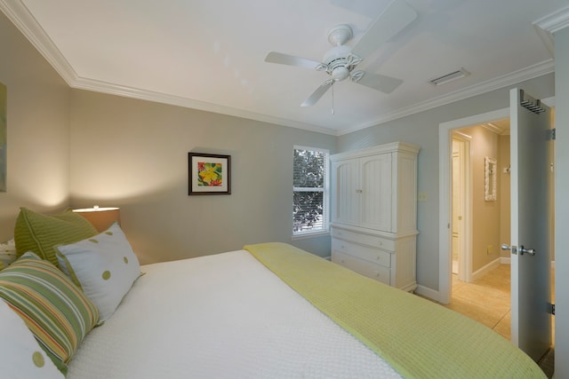 tiled bedroom featuring ceiling fan and ornamental molding