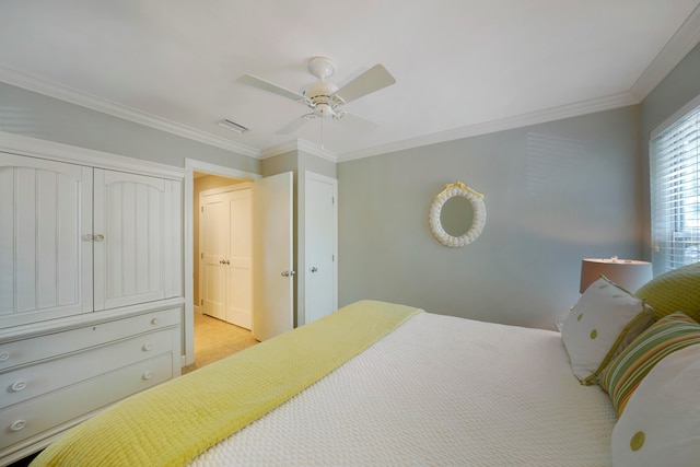 bedroom featuring ornamental molding, light tile patterned floors, and ceiling fan