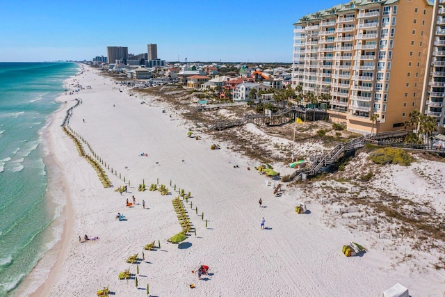 birds eye view of property featuring a view of the beach and a water view