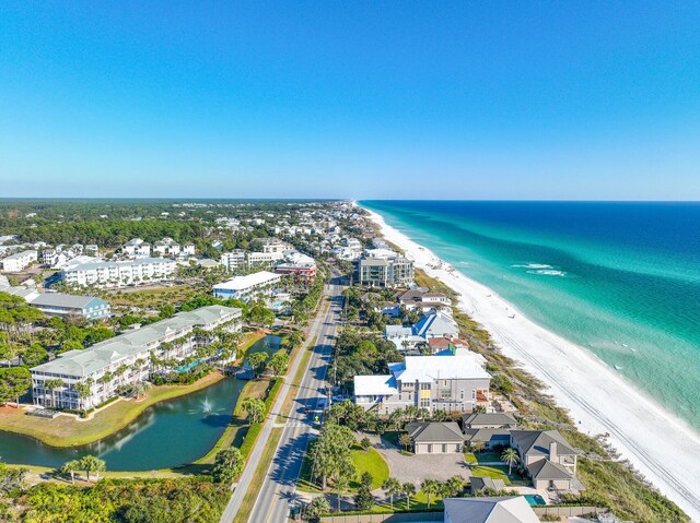 aerial view with a water view and a view of the beach