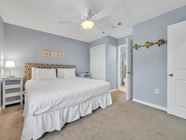 carpeted bedroom with baseboards, visible vents, a ceiling fan, a textured ceiling, and a closet