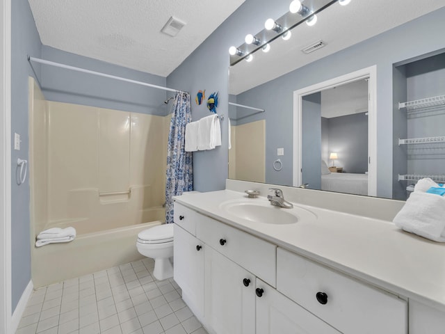 ensuite bathroom featuring visible vents, toilet, ensuite bathroom, a textured ceiling, and vanity