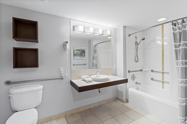 full bathroom with shower / bath combo, sink, tile patterned floors, and toilet