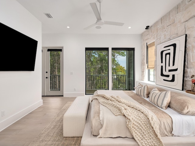 bedroom featuring access to outside, light hardwood / wood-style floors, and ceiling fan