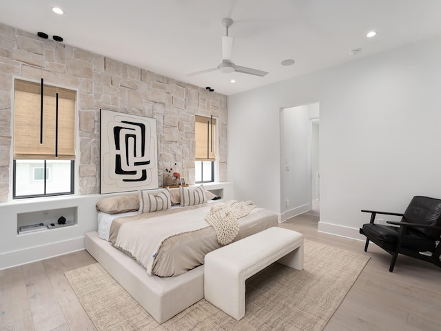 bedroom featuring ceiling fan and light wood-type flooring