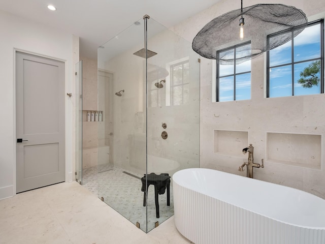 bathroom with separate shower and tub